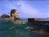 Colleen swiming with the raft